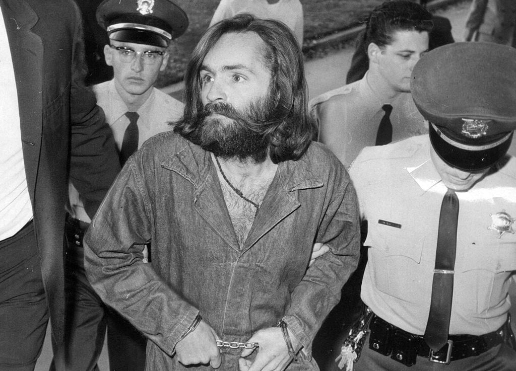 LOS ANGELES, CA - DECEMBER 3: Charles Manson is escorted to court for preliminary hearing on December 3, 1969 in Los Angeles, California.  (Photo by John Malmin/Los Angeles Times via Getty Images)