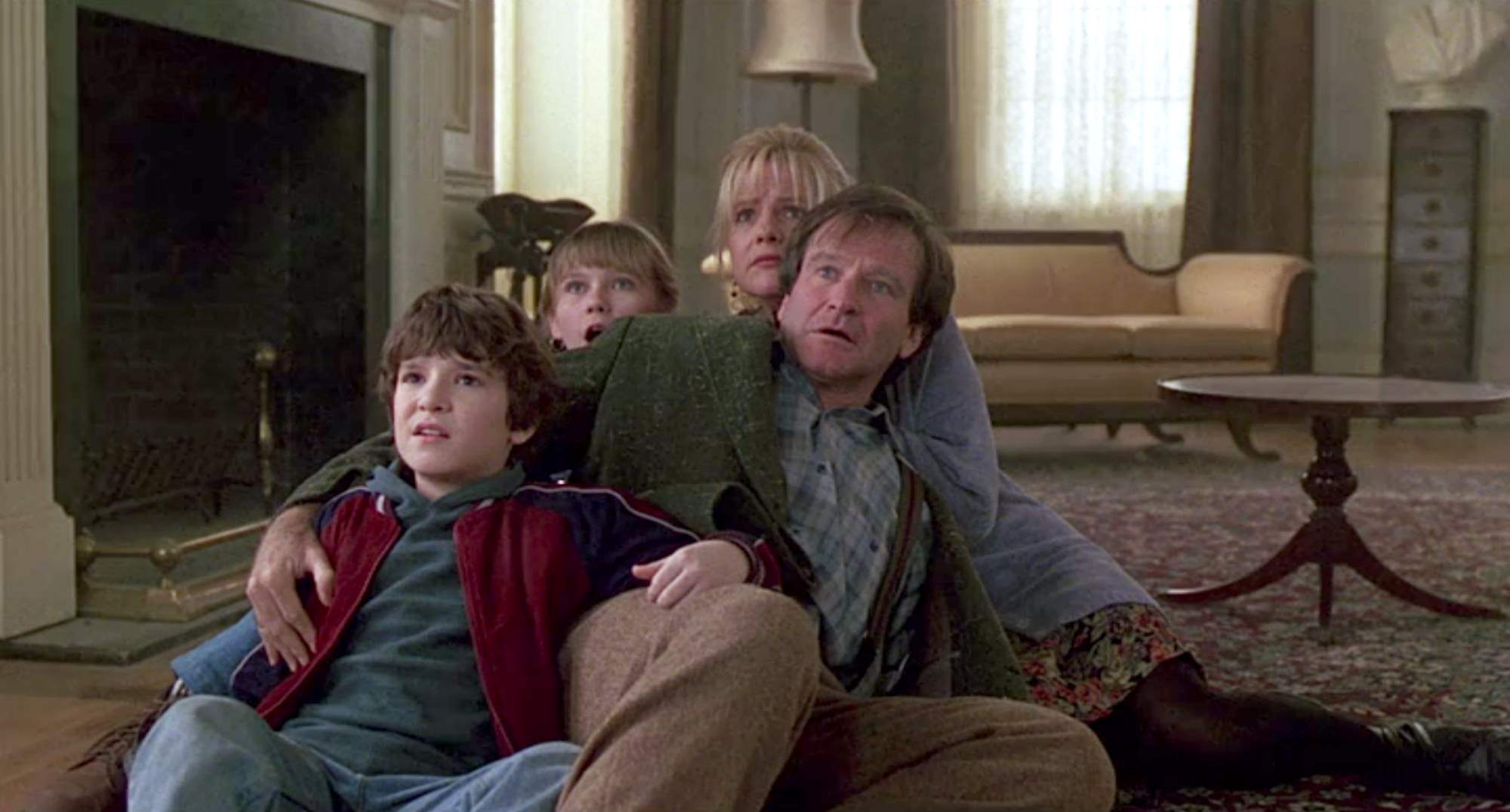 Robin Williams, Bradley Pierce, Bonnie Hunt och Kirsten Dunst i Jumanji.